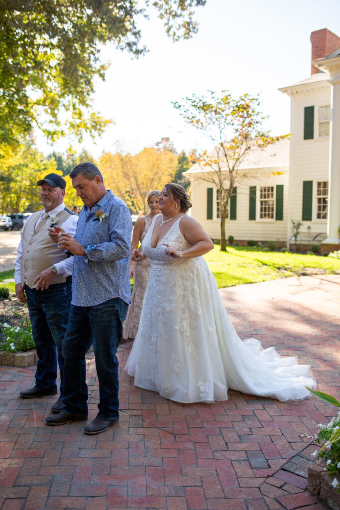 Bride's first look with father and step father